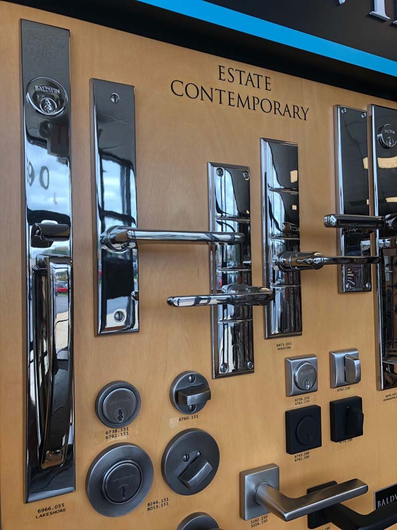 Residential locksmith installing a new deadbolt on a Ballwin, Missouri home